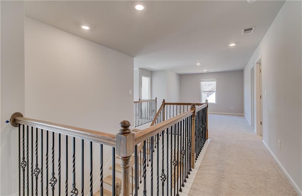 228 Ruthe Cove Locust Grove, GA 30248 - Photo 22 of 31 a view of a hallway with a window