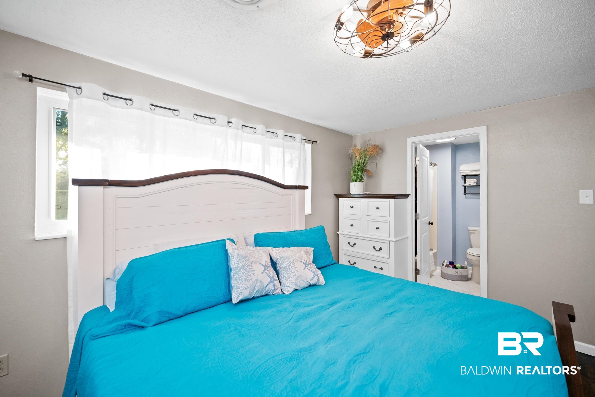 401 West Myrtle Avenue Foley, AL 36535 - Photo 24 of 39 Bedroom with ensuite bathroom and a textured ceiling