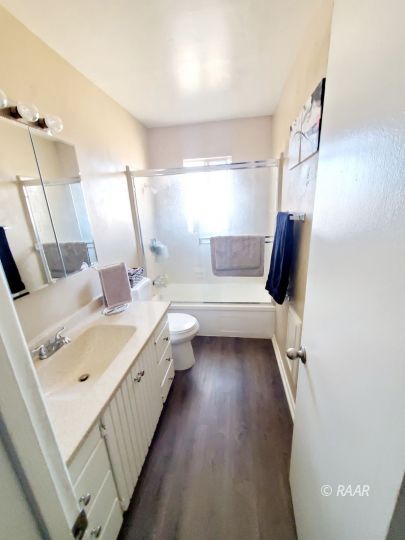 224 West Perdew Avenue Ridgecrest, CA 93555 - Photo 10 of 17 a bathroom with a double vanity sink and mirror