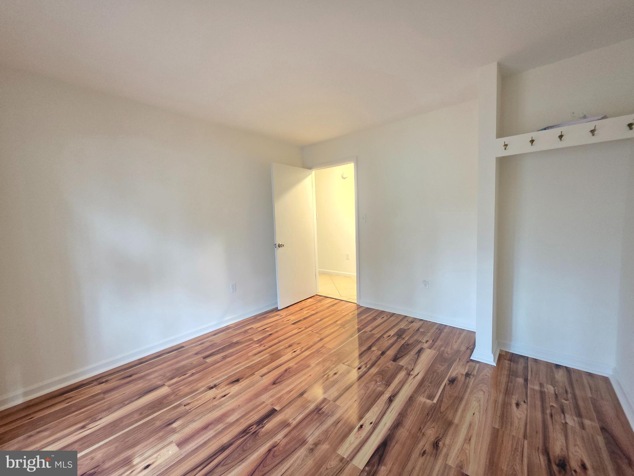 13 Sailors Way Ocean Pines, MD 21811 - Photo 17 of 33 a view of empty room with wooden floor and fan