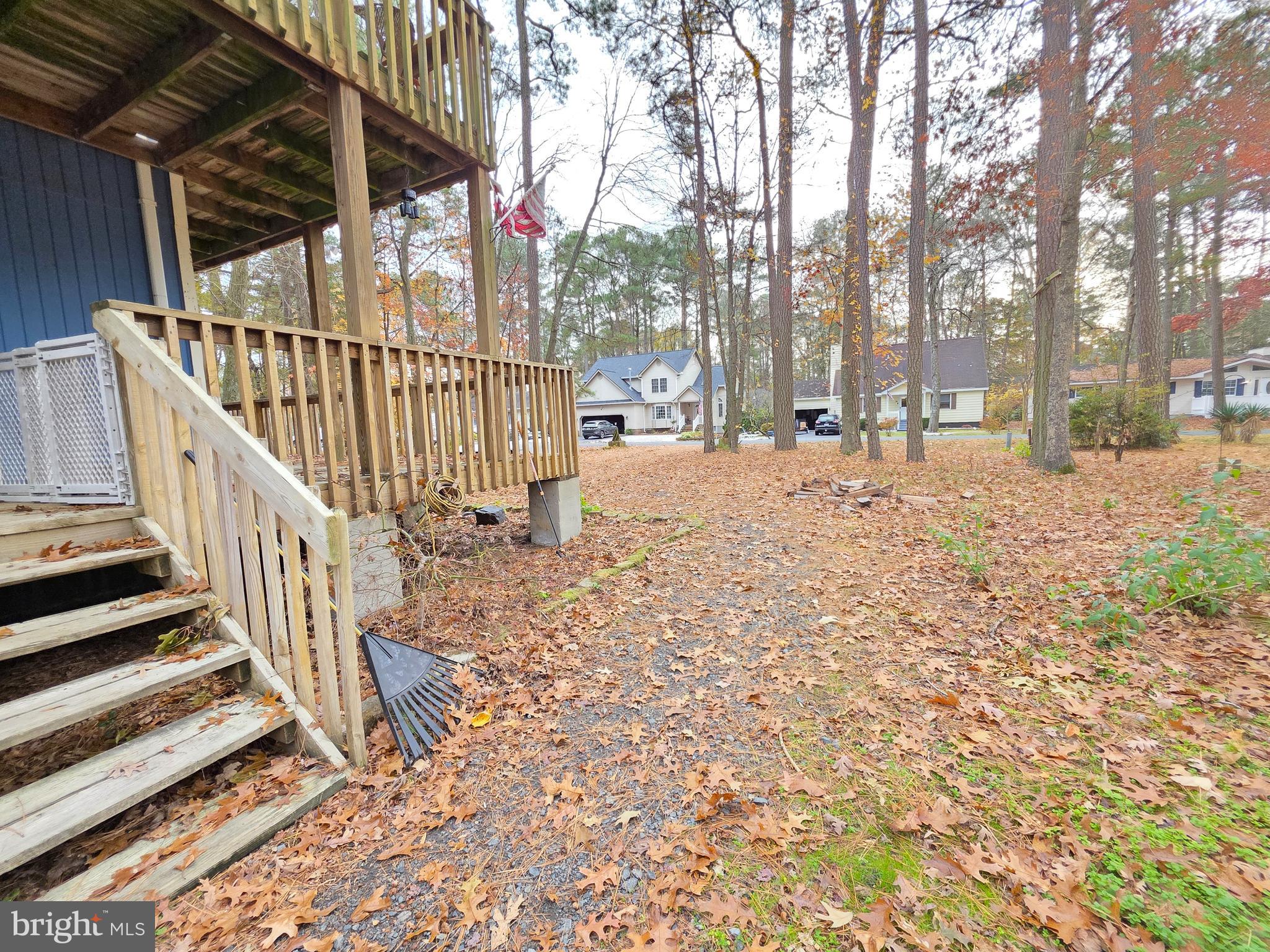 13 Sailors Way Ocean Pines, MD 21811 - Photo 30 of 33 a view of a backyard with wooden fence and large trees