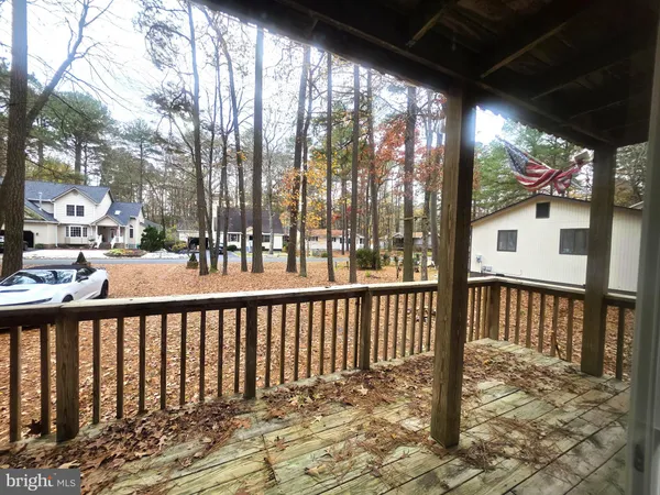a view of a street with wooden fence