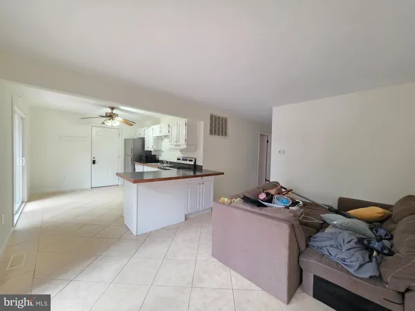 a kitchen with granite countertop a sink and a stove