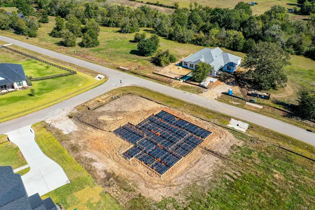a view of a swimming pool and lounge chair