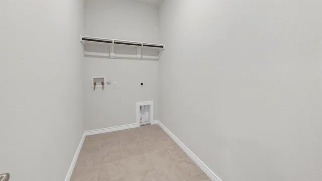 a view of kitchen with stainless steel appliances kitchen island a refrigerator sink and cabinets