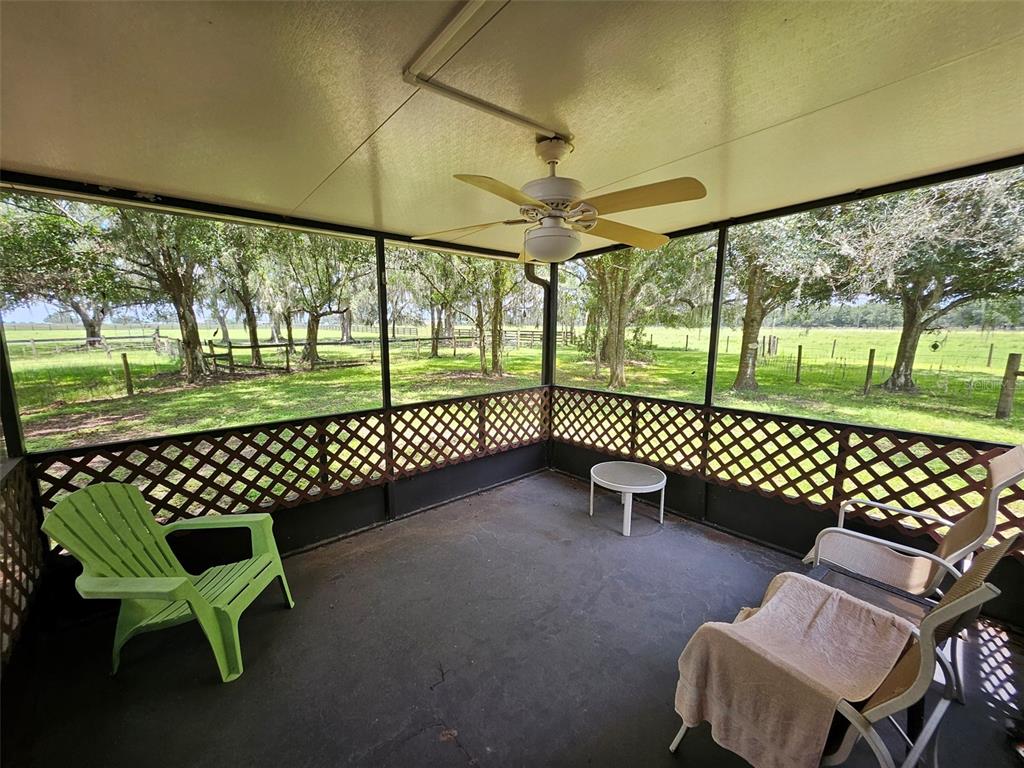 2596 96th Street Arcadia, FL 34266 - Photo 11 of 59 a view of a porch with a bench