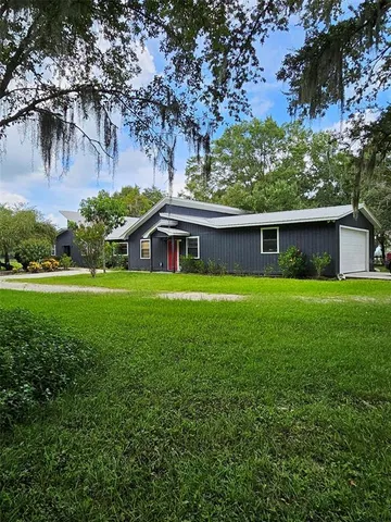 a view of a yard with tree s