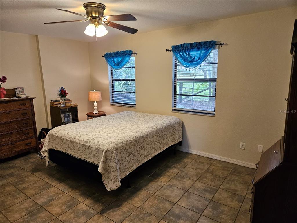 2596 96th Street Arcadia, FL 34266 - Photo 37 of 59 a bedroom with a bed dresser and a window