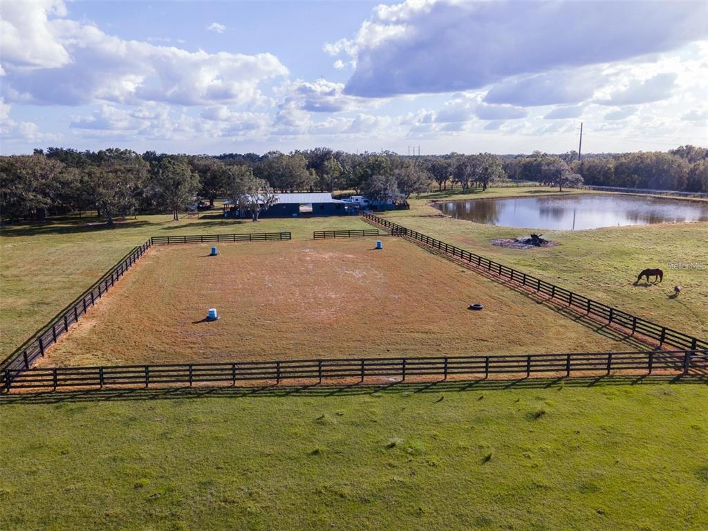 2596 96th Street Arcadia, FL 34266 - Photo 56 of 59 a view of a swimming pool and an outdoor seating