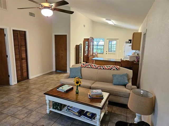 a living room with furniture and a window