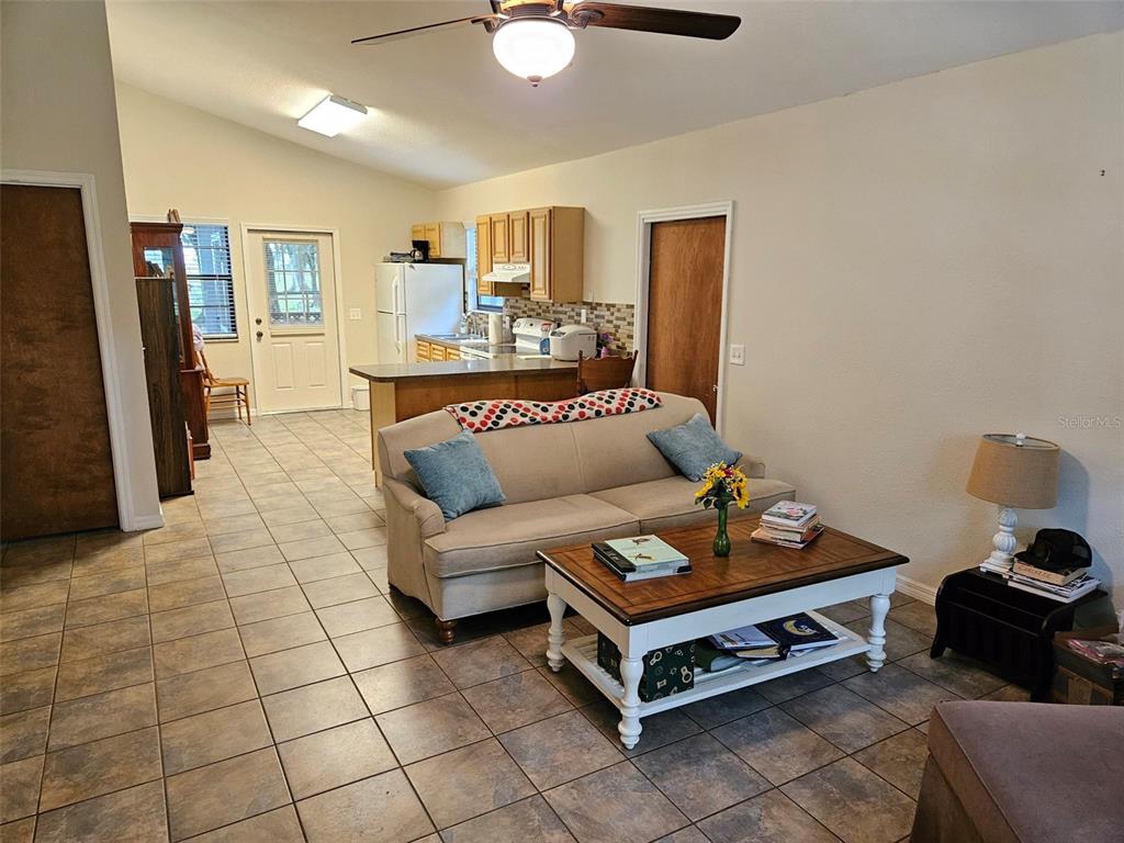 2596 96th Street Arcadia, FL 34266 - Photo 10 of 59 a living room with furniture and a flat screen tv