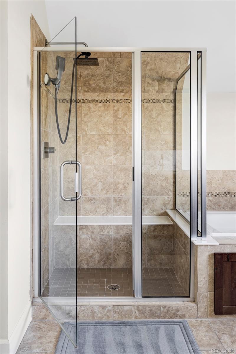 2908 Ironton Street Denver, CO 80238 - Photo 15 of 30 a bathroom with a glass shower door