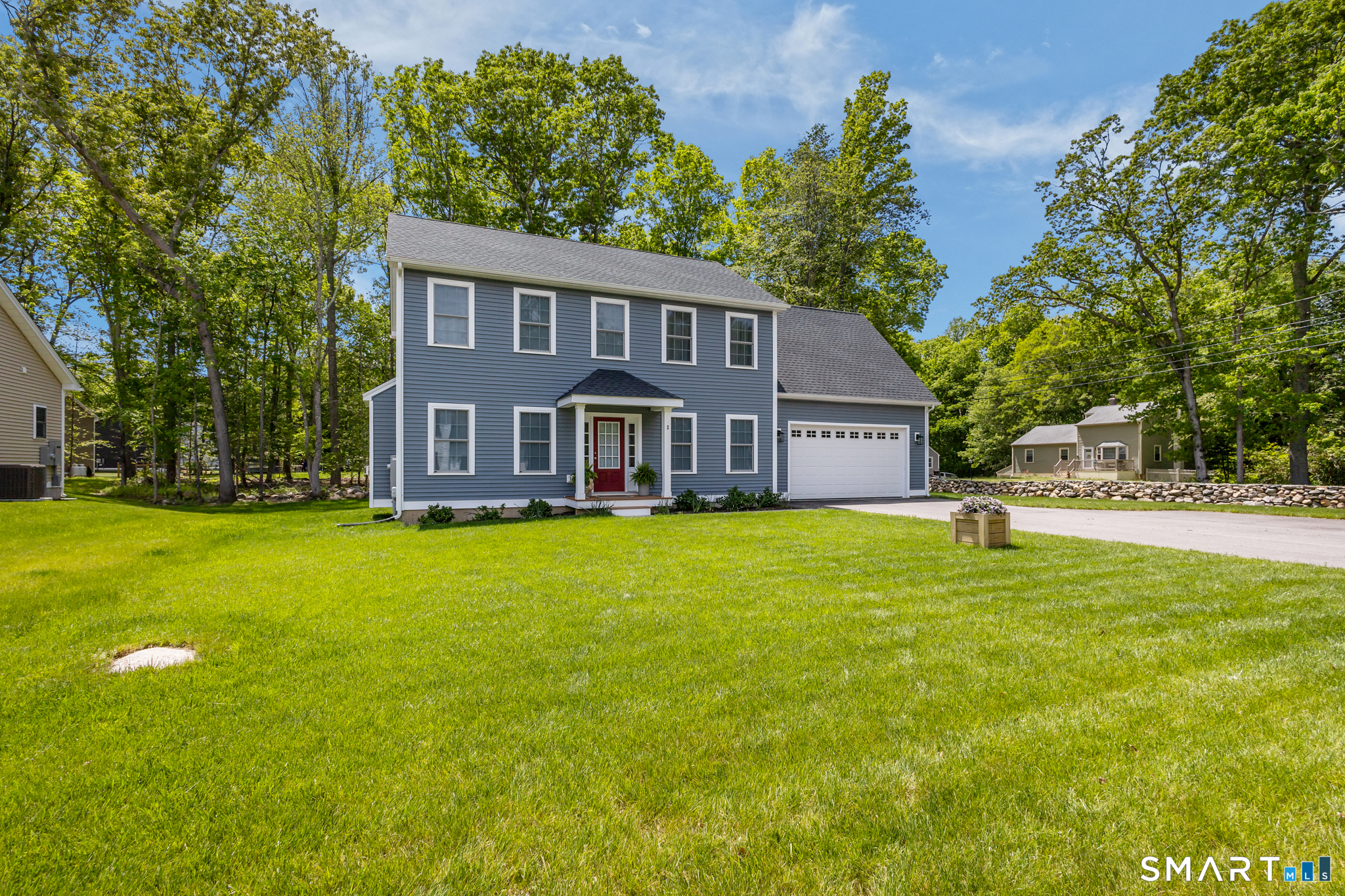 2 Martys Way Gales Ferry, CT 06335 - Photo 37 of 40 a front view of a house with a garden