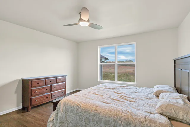 a front view of a house with yard and green space