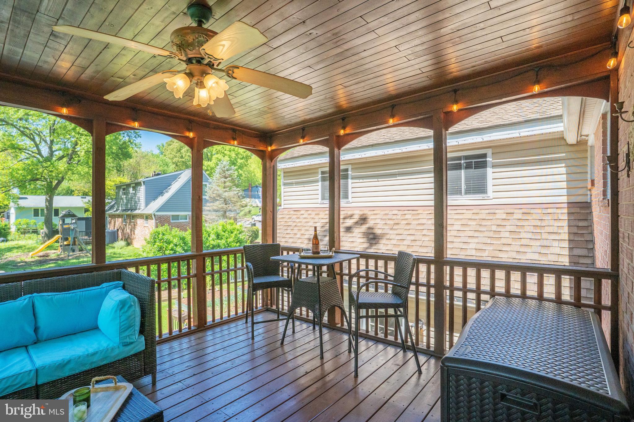5300 Kings Park Drive Springfield, VA 22151 - Photo 14 of 62 a view of a porch with furniture and wooden floor