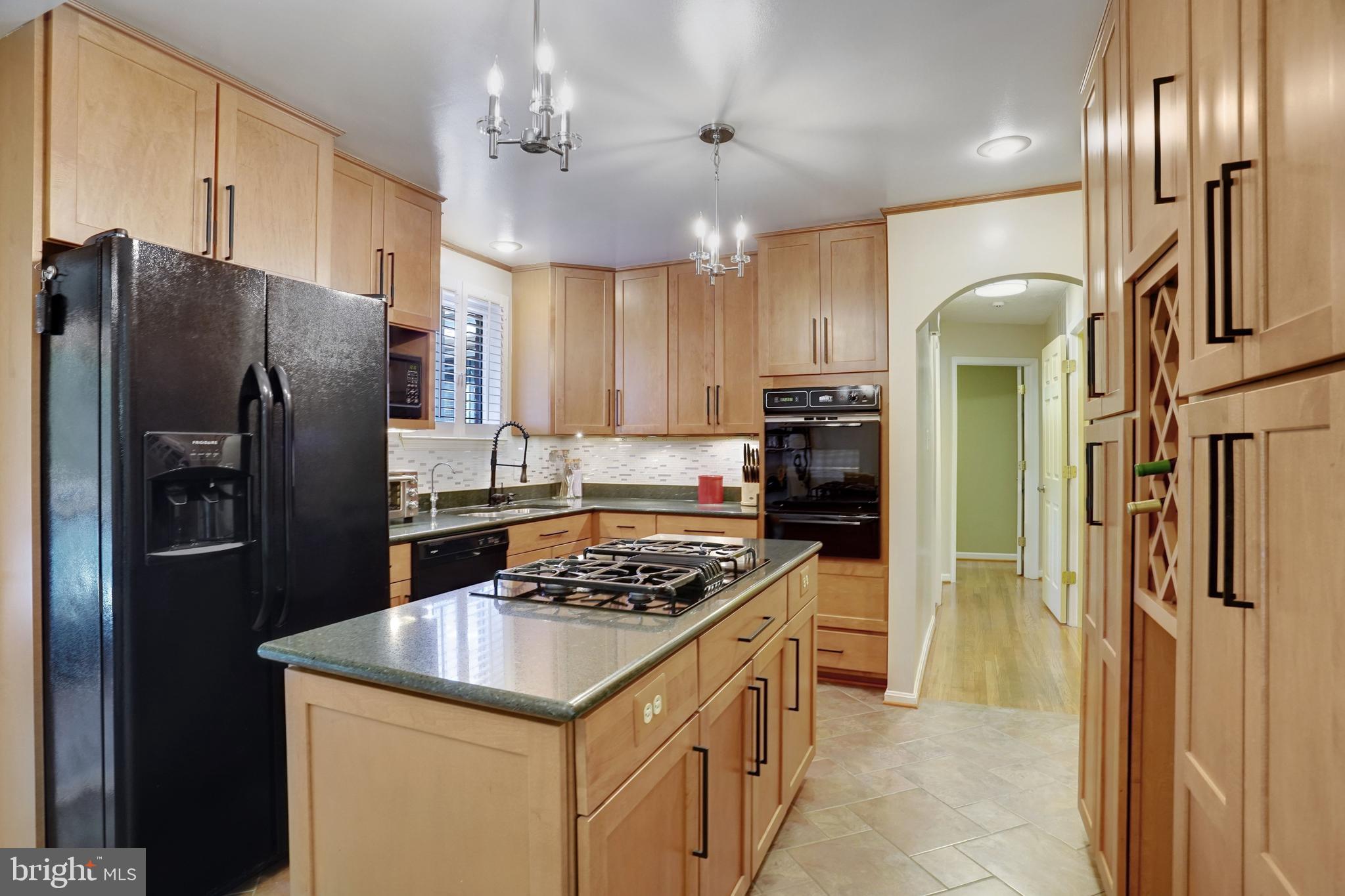 5300 Kings Park Drive Springfield, VA 22151 - Photo 16 of 62 a kitchen with stainless steel appliances granite countertop a refrigerator a stove and a sink
