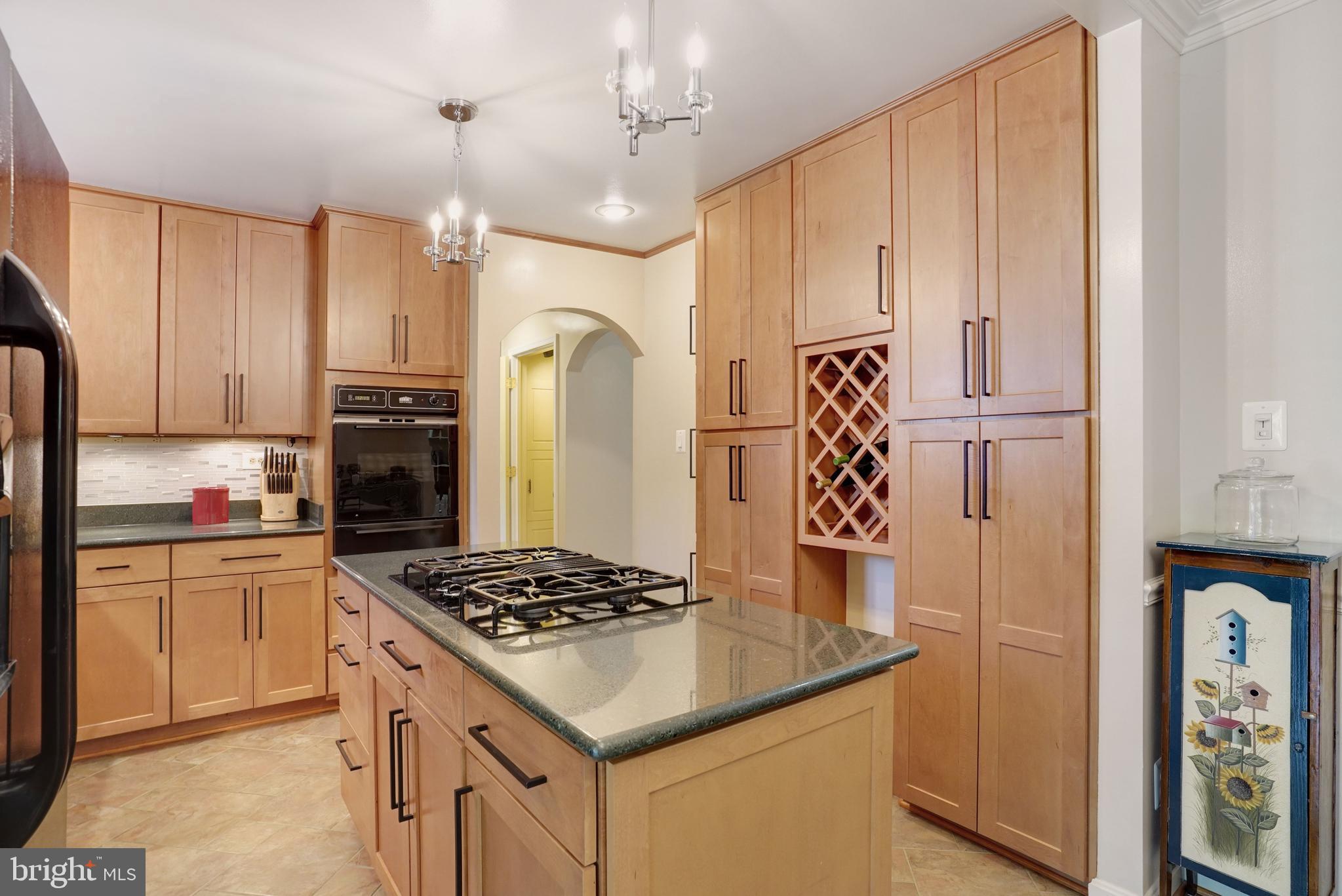 5300 Kings Park Drive Springfield, VA 22151 - Photo 19 of 62 a kitchen with stainless steel appliances granite countertop a refrigerator and a stove top oven