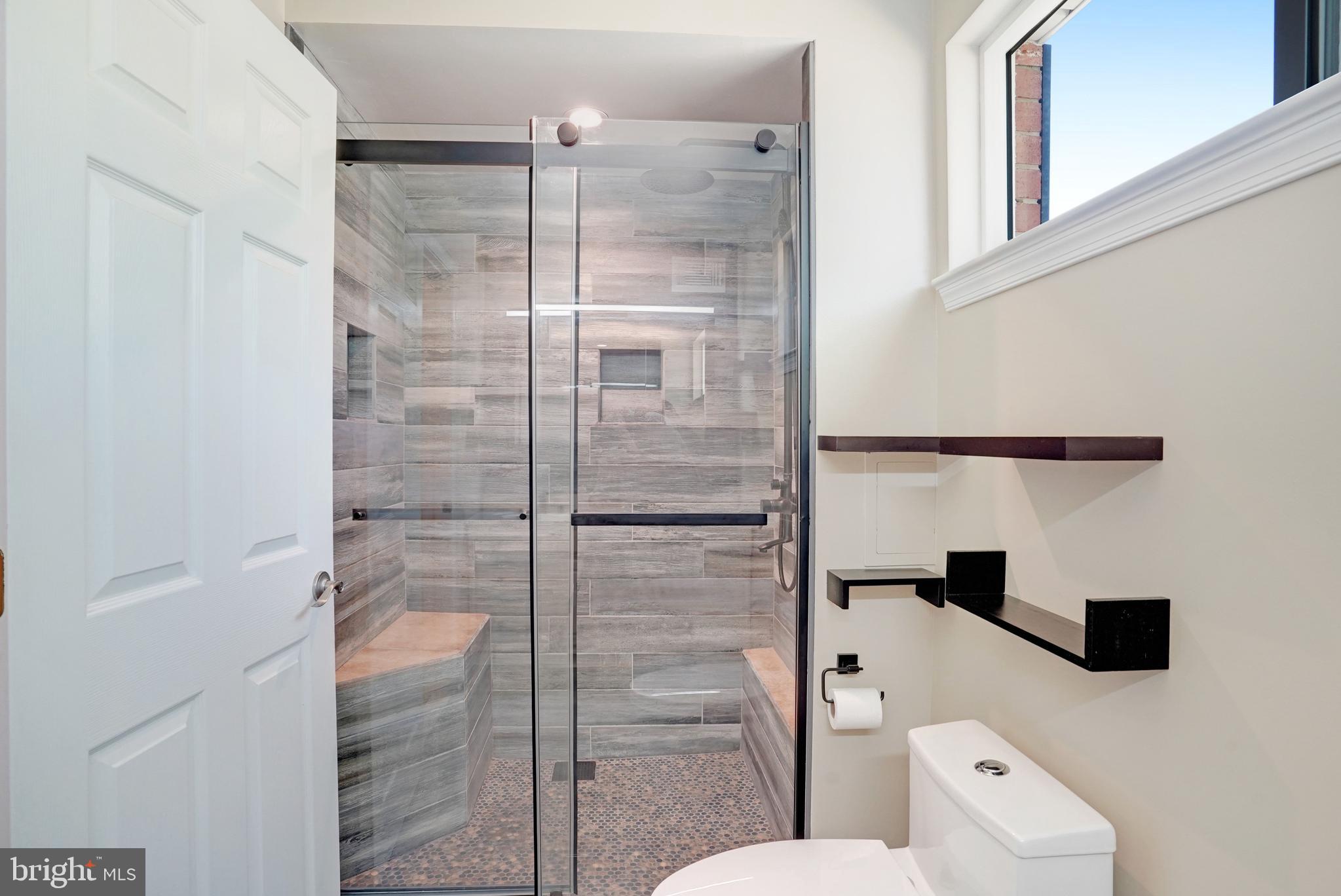 5300 Kings Park Drive Springfield, VA 22151 - Photo 25 of 62 a bathroom with a shower and toilet