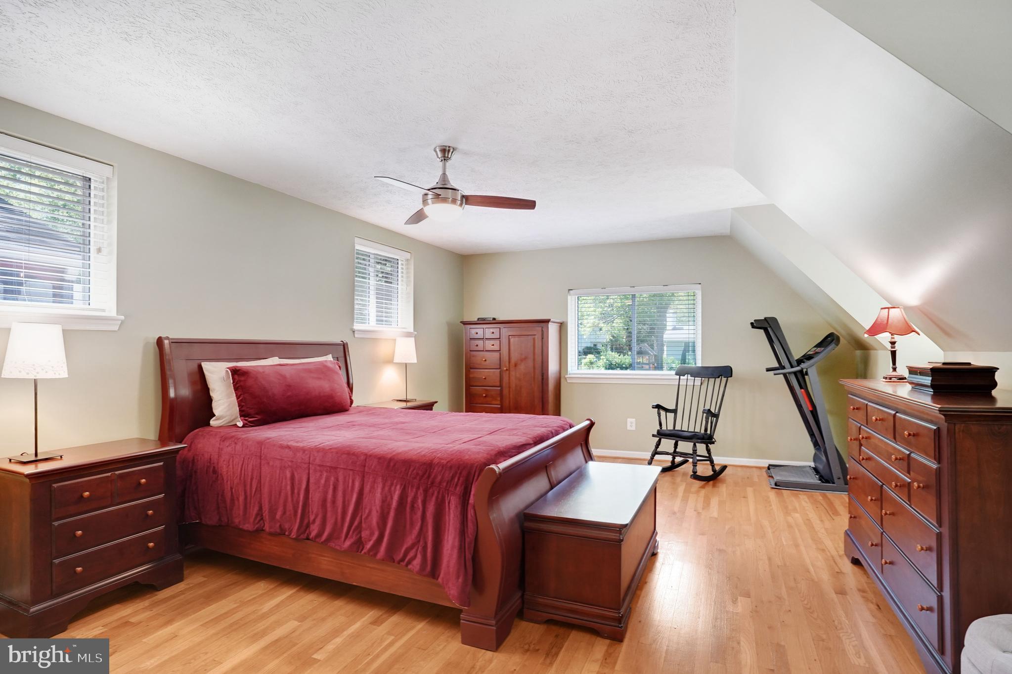5300 Kings Park Drive Springfield, VA 22151 - Photo 27 of 62 a bedroom with a bed and a chandelier
