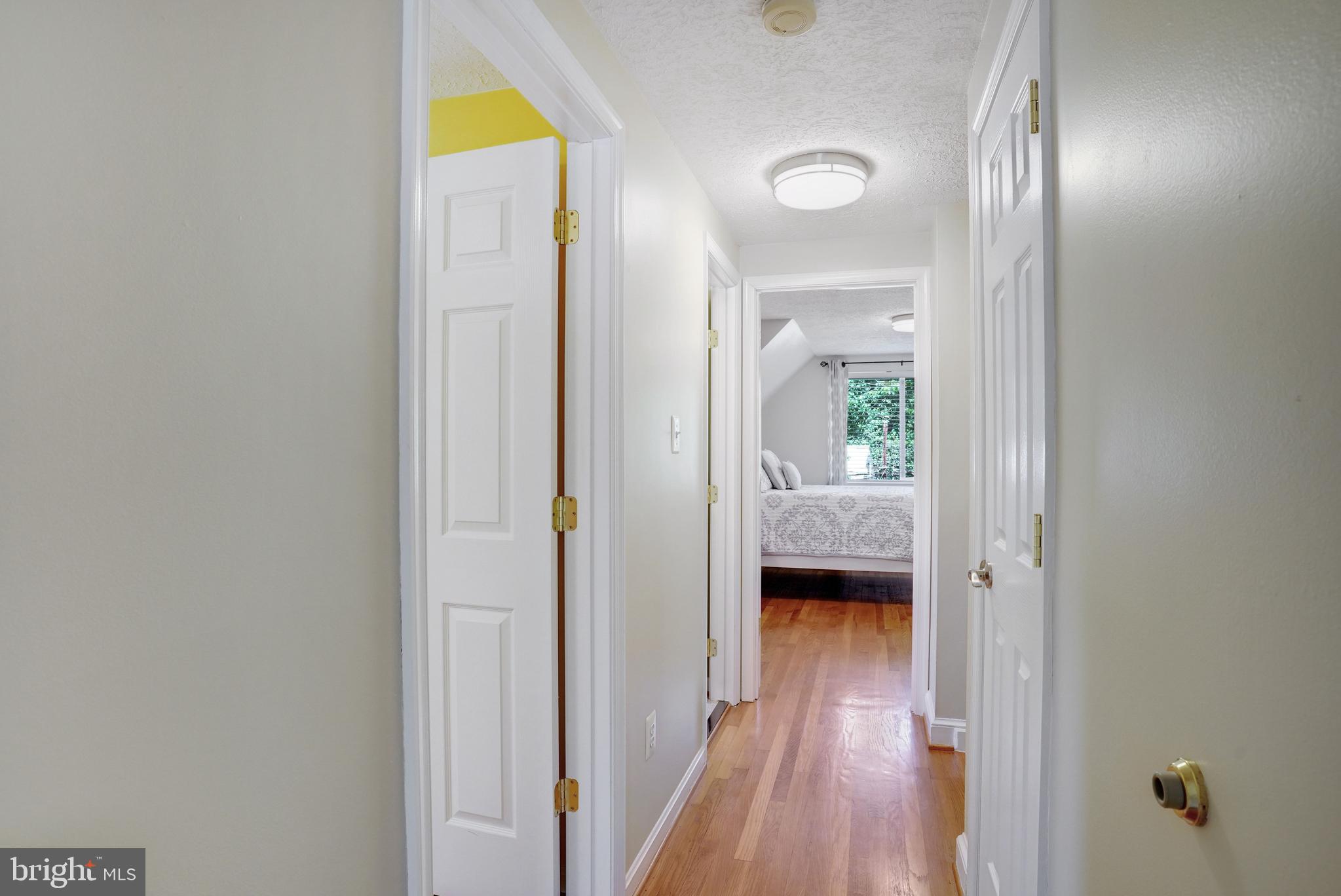 5300 Kings Park Drive Springfield, VA 22151 - Photo 30 of 62 a view of a hallway with wooden floor and a bedroom