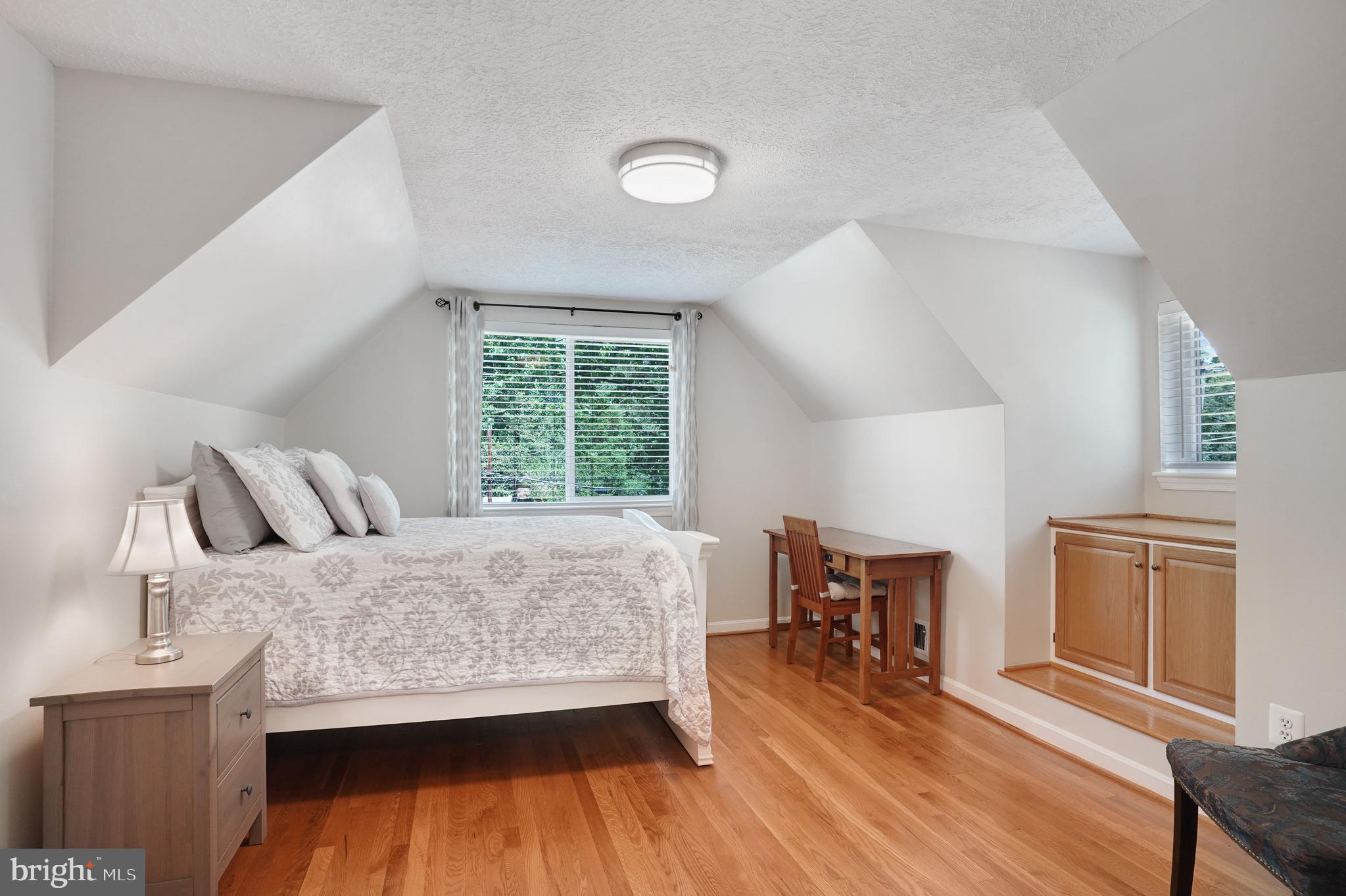5300 Kings Park Drive Springfield, VA 22151 - Photo 31 of 62 a bedroom with a bed and wooden floor