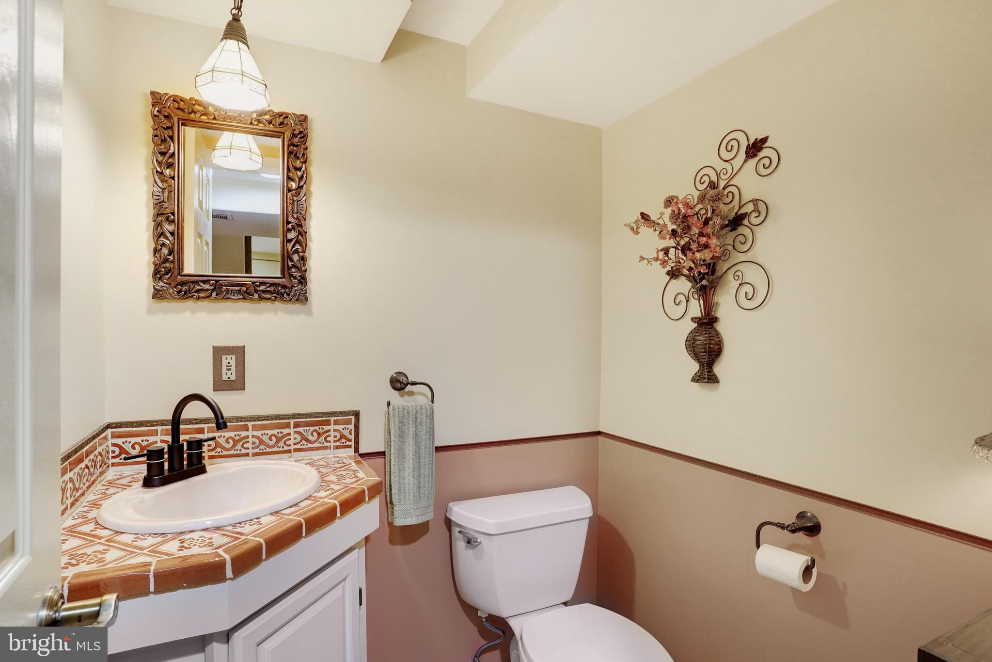 5300 Kings Park Drive Springfield, VA 22151 - Photo 46 of 62 a bathroom with a sink mirror vanity and toilet