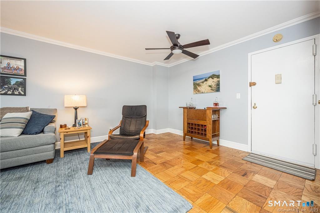 50 Glenbrook Road, Unit 6E Stamford, CT 06902 - Photo 5 of 18 a bedroom with a bed and a table in it