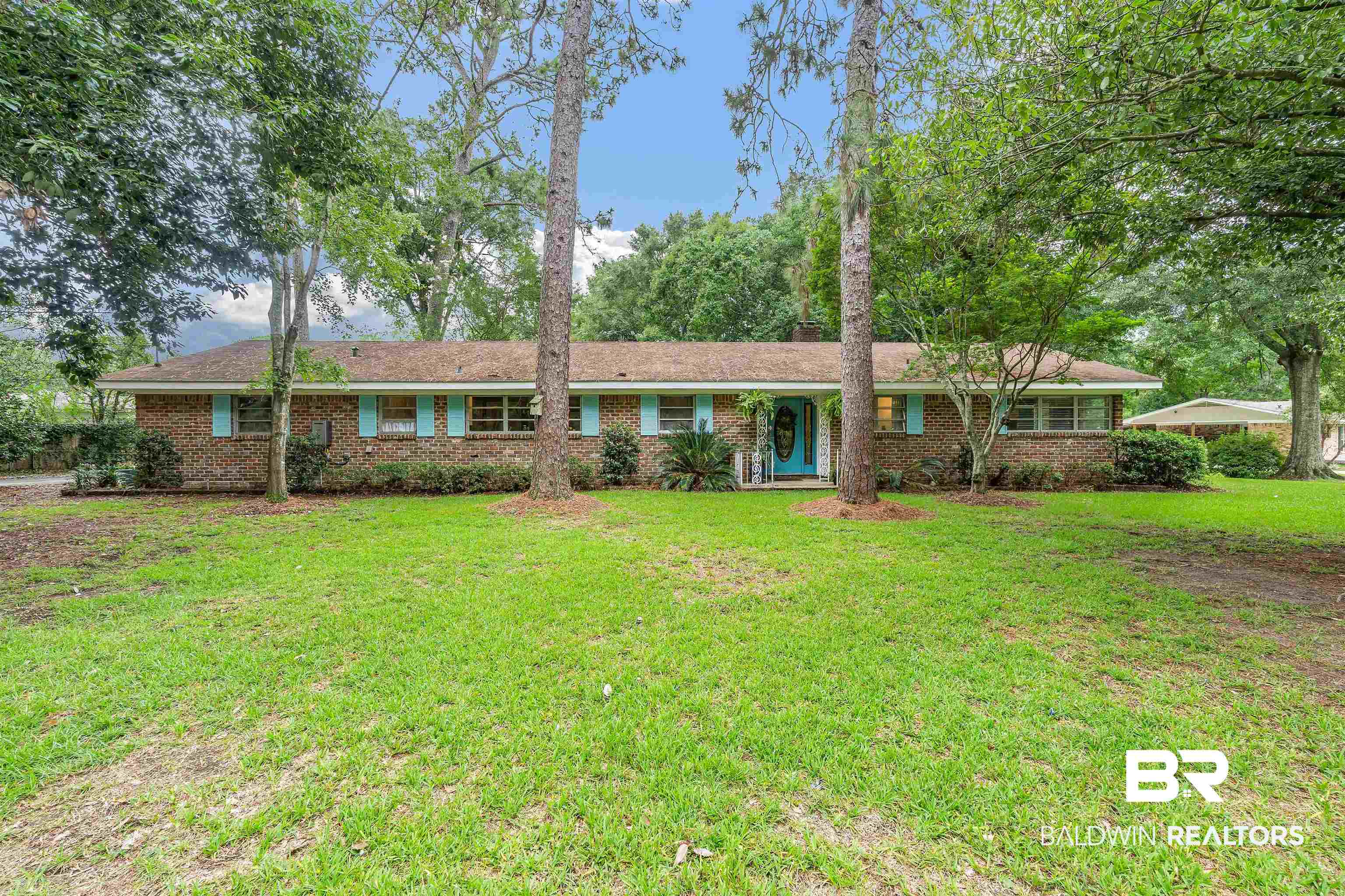 4051 East Canal Circle Mobile, AL 36619 - Photo 1 of 32 Ranch-style house with a front yard