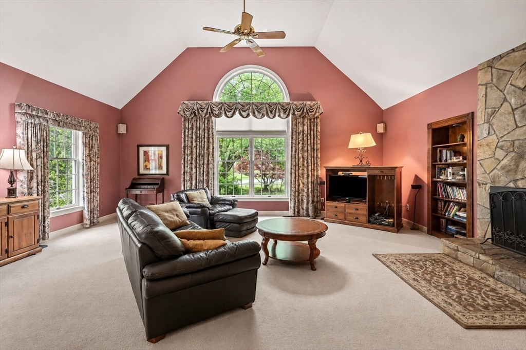 37 Old Planters Road Beverly, MA 01915 - Photo 19 of 42 a living room with furniture a fireplace and a table