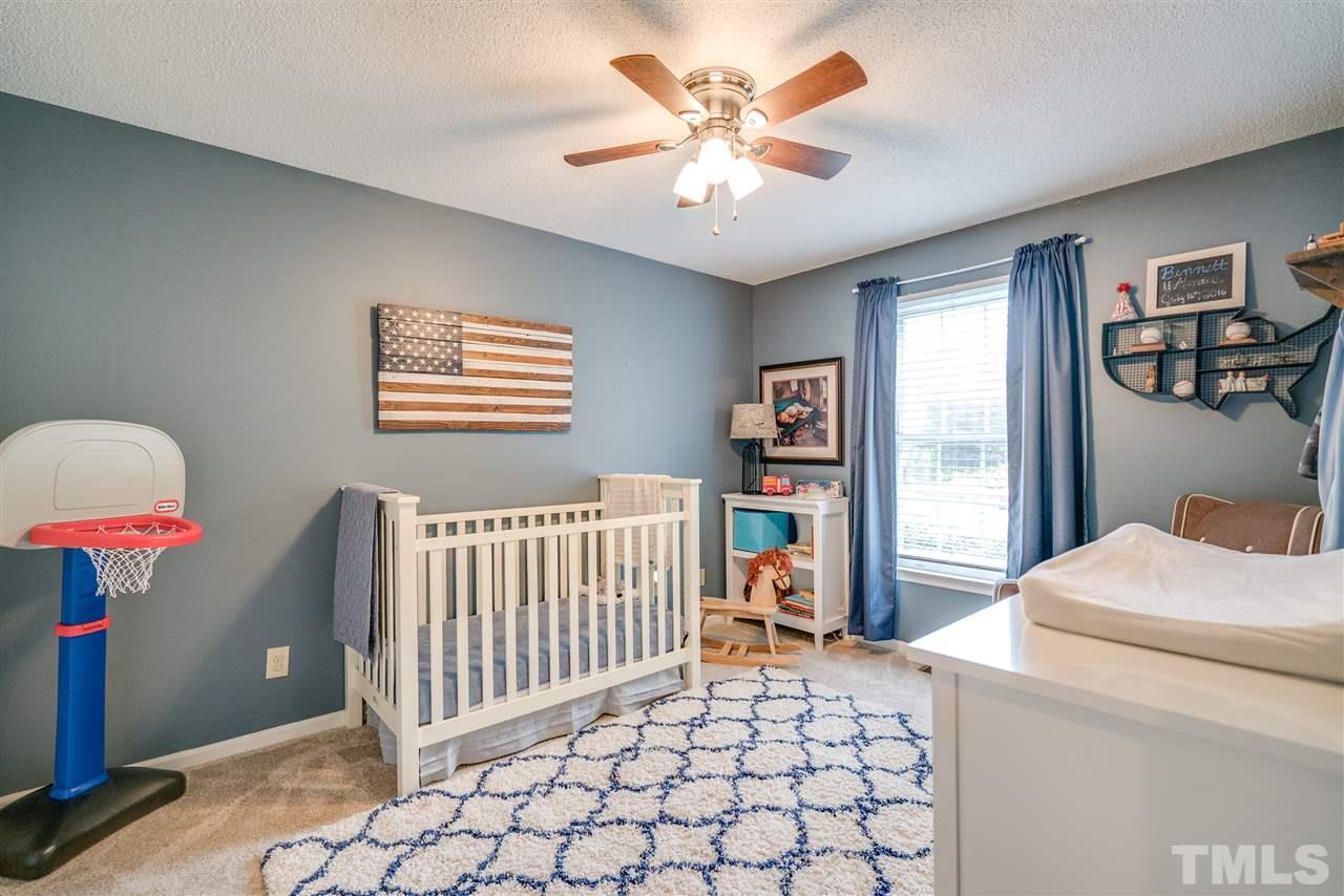 4541 Birmingham Way Raleigh, NC 27604 - Photo 14 of 25 a bedroom with furniture and a window