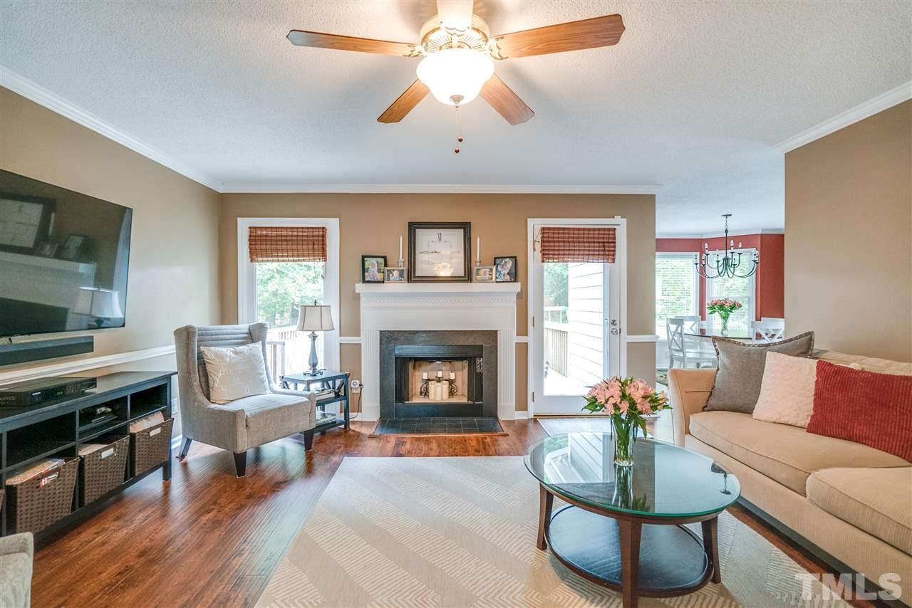 4541 Birmingham Way Raleigh, NC 27604 - Photo 3 of 25 a living room with furniture and a fireplace
