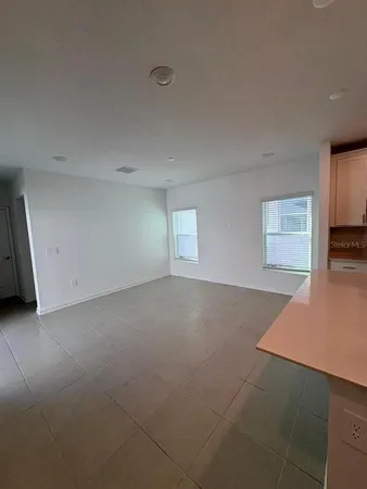 a kitchen with refrigerator cabinets and a sink