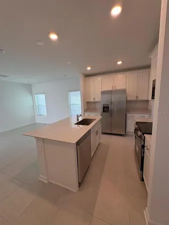 a bathroom with a double vanity sink and mirror