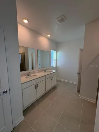 a kitchen view with stainless steel appliances a refrigerator a stove a microwave and cabinets