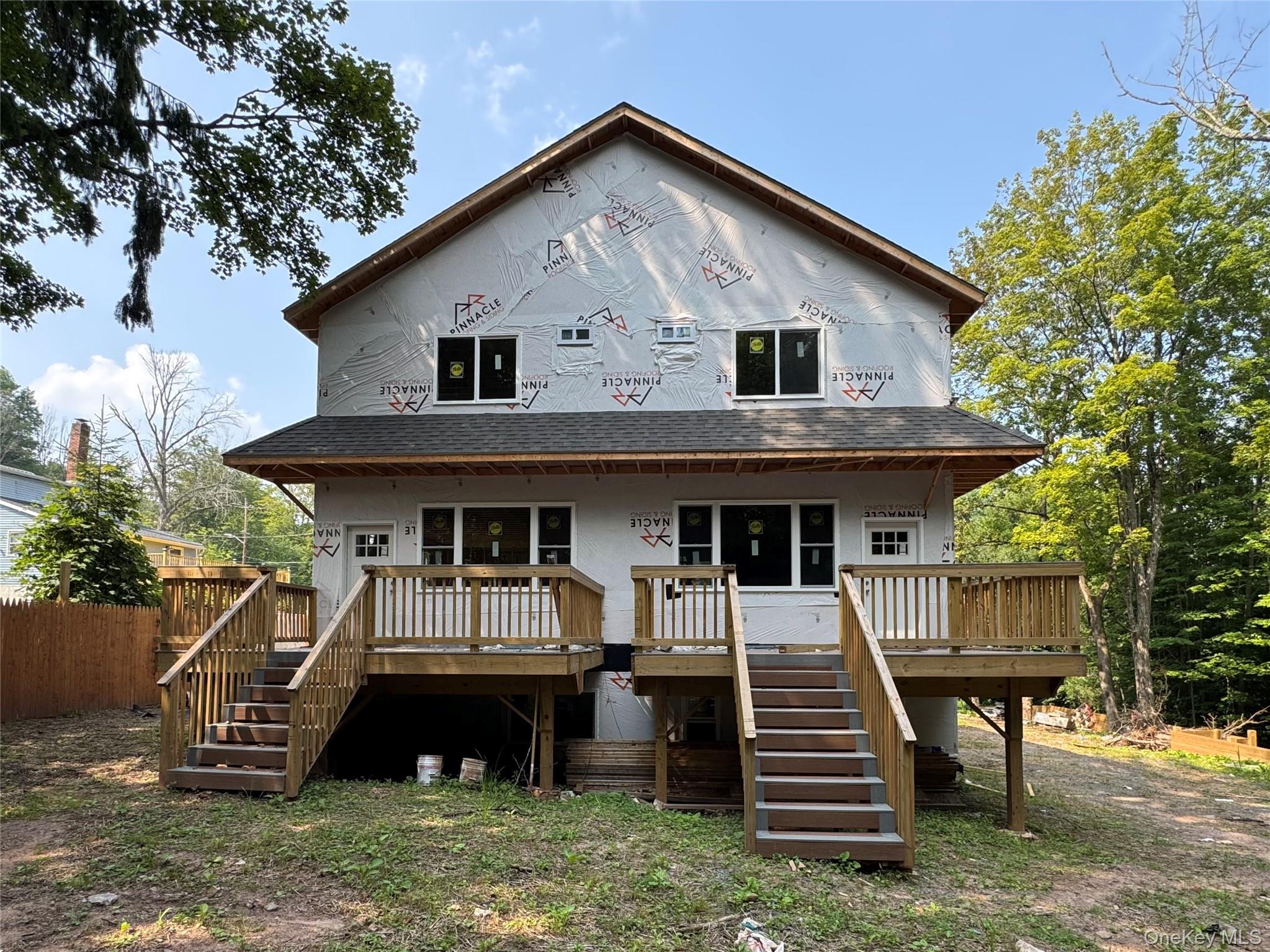 2 St Peters Place Liberty, NY 12754 - Photo 3 of 16 a front view of a house with a yard