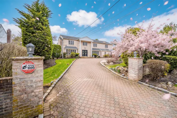 a view of a street with potted plants