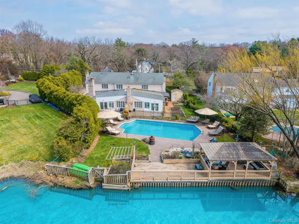 a view of a lake with a house in the background