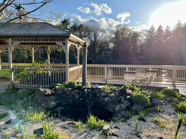 a view of a house with a flower garden
