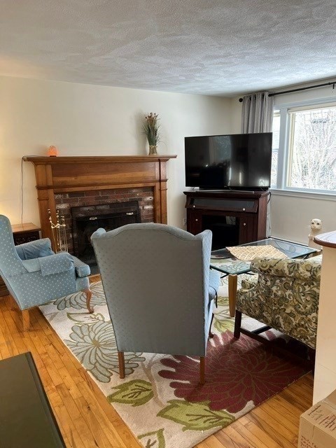 438 Old Bedford Road Concord, MA 01742 - Photo 14 of 31 a living room with furniture and a flat screen tv