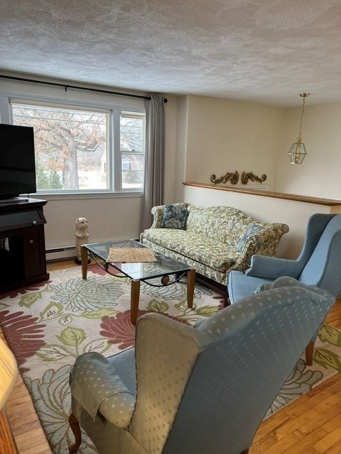 438 Old Bedford Road Concord, MA 01742 - Photo 15 of 31 a living room with furniture and a flat screen tv