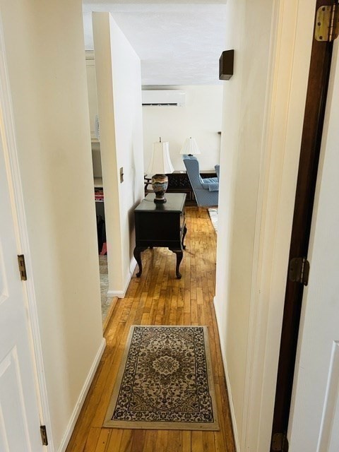 438 Old Bedford Road Concord, MA 01742 - Photo 18 of 31 a hallway with a wooden floor