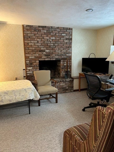 438 Old Bedford Road Concord, MA 01742 - Photo 25 of 31 a bedroom with furniture and a fireplace