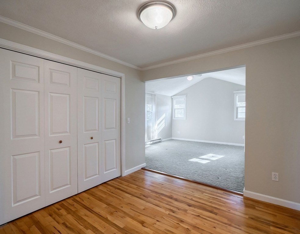 438 Old Bedford Road Concord, MA 01742 - Photo 6 of 31 a view of an empty room with wooden floor