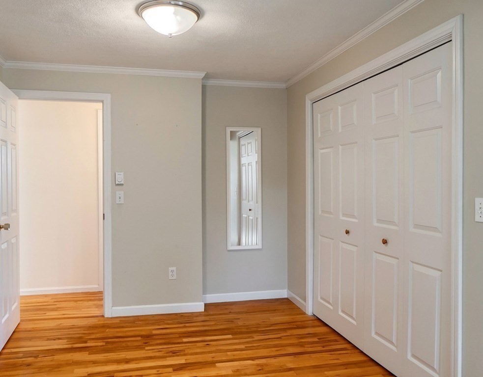 438 Old Bedford Road Concord, MA 01742 - Photo 7 of 31 a view of an empty room with wooden floor