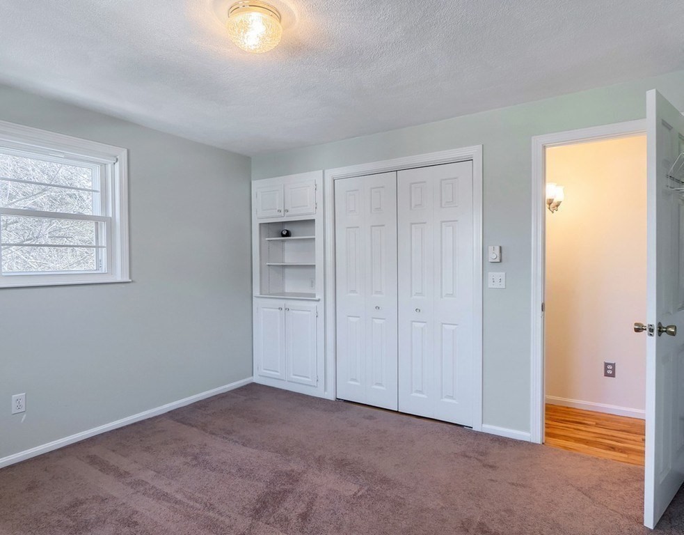 438 Old Bedford Road Concord, MA 01742 - Photo 8 of 31 a view of an empty room with closet and a window