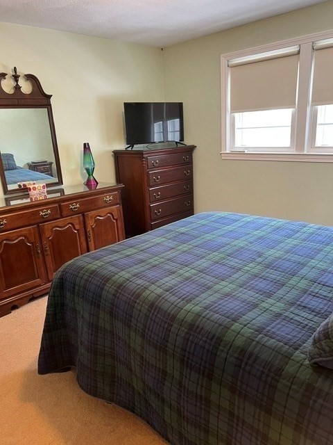 438 Old Bedford Road Concord, MA 01742 - Photo 9 of 31 a bedroom with a bed and wooden floor
