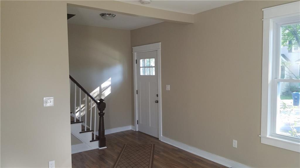 21 Maple Street Westbrook, ME 04092 - Photo 11 of 15 Living room facing the front entry
