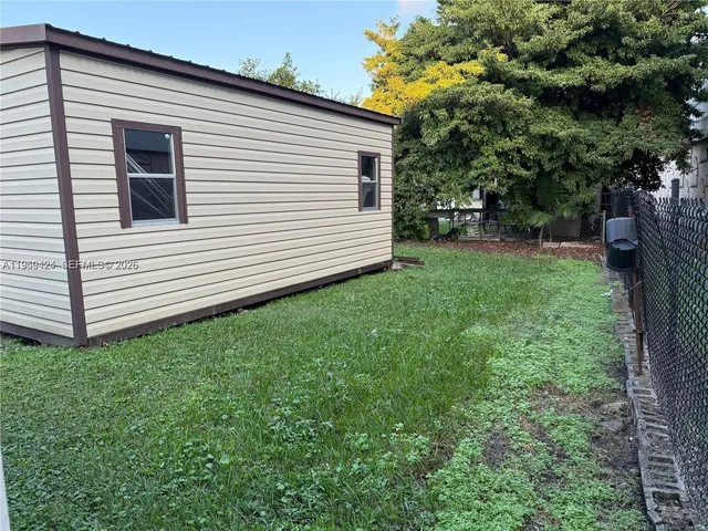 a view of a back yard of the house