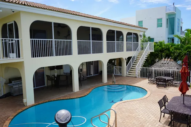 a view of a livingroom with furniture a fireplace and wooden floor