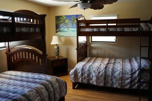 a bedroom with a bed and dresser